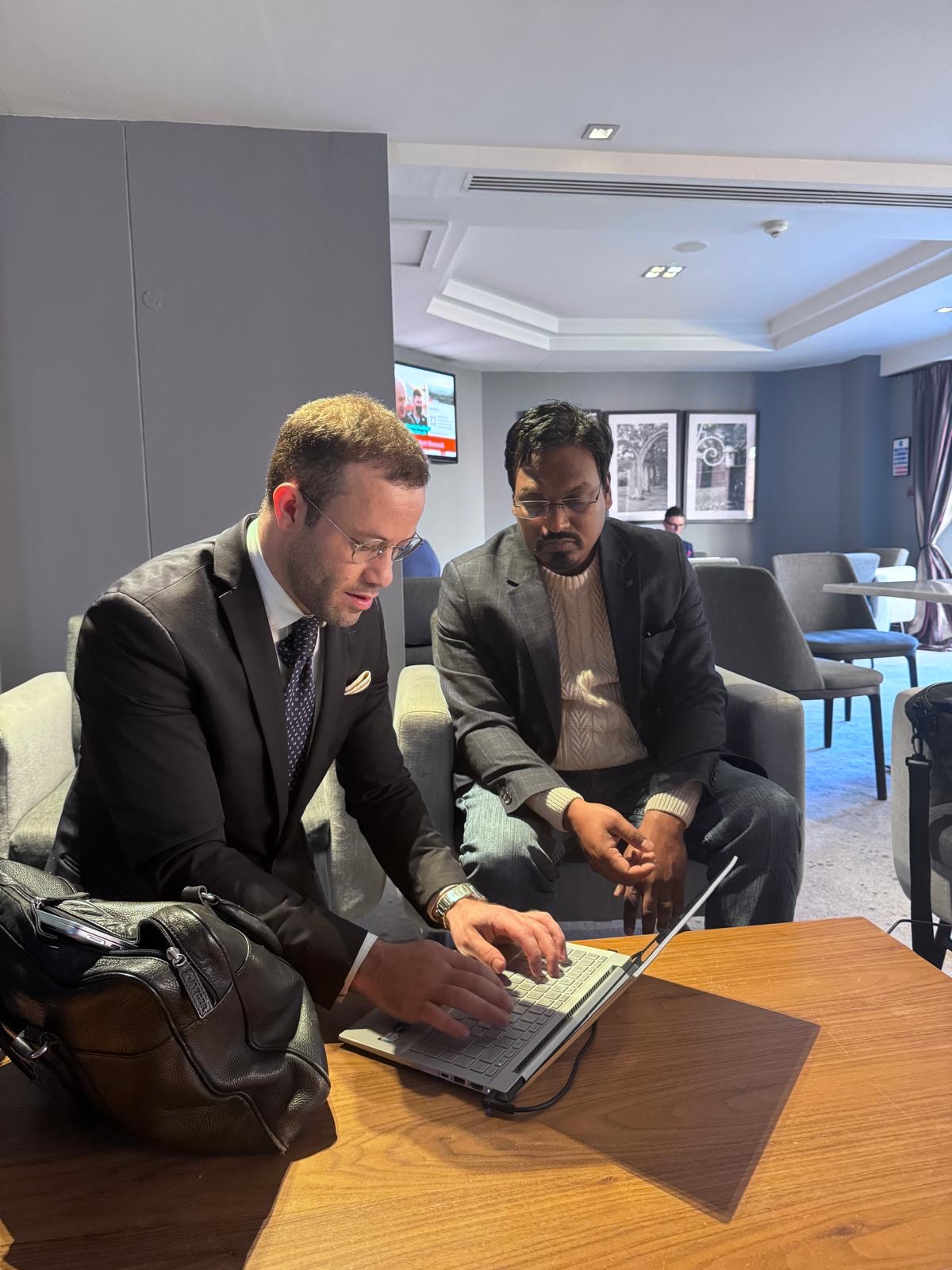 Simple Day founder showing a client their tailored proposal on a laptop
